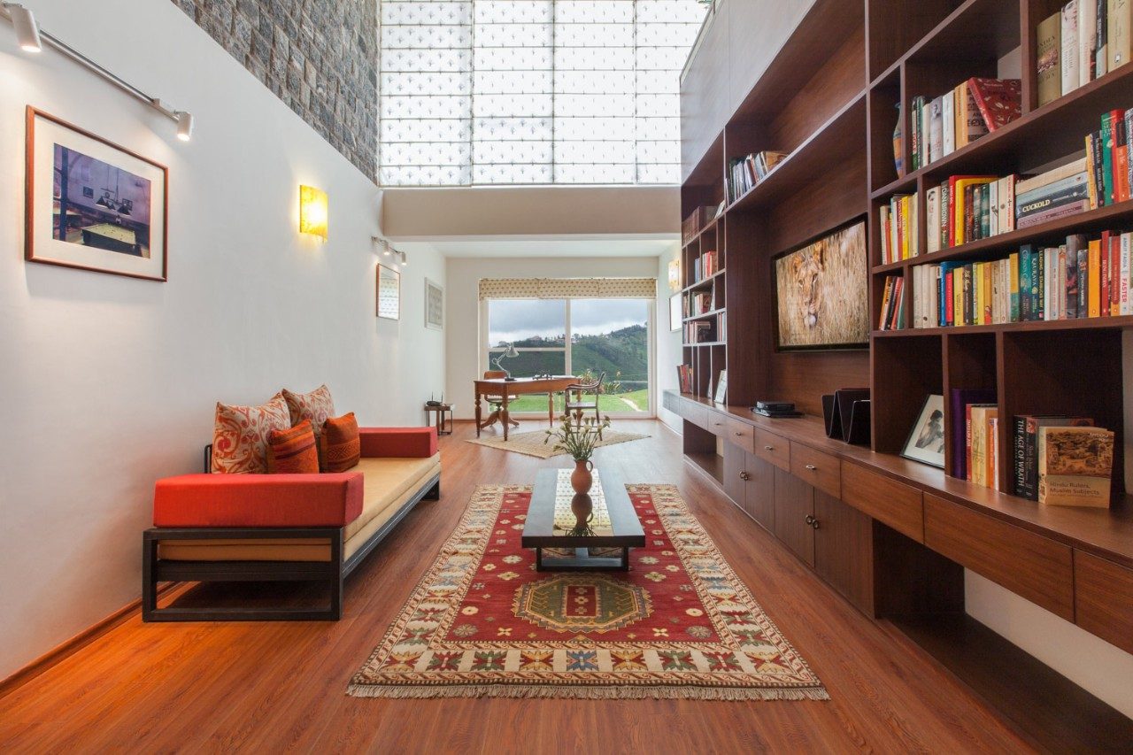 A floor to ceiling shelf with lots of books on it - Beautiful Homes